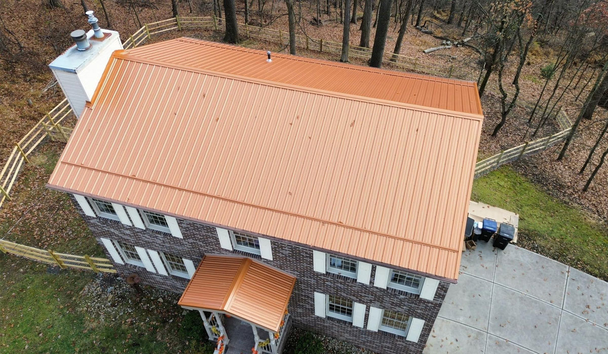 Metal roofing installation on a residential property in Pittsburgh, showcasing durability and weather resilience against local climate conditions.