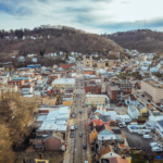 Aerial view of McCandless, Pennsylvania, showcasing residential and commercial buildings, with emphasis on rooftops, relevant for homeowners seeking roofing repair and maintenance services post-storm.