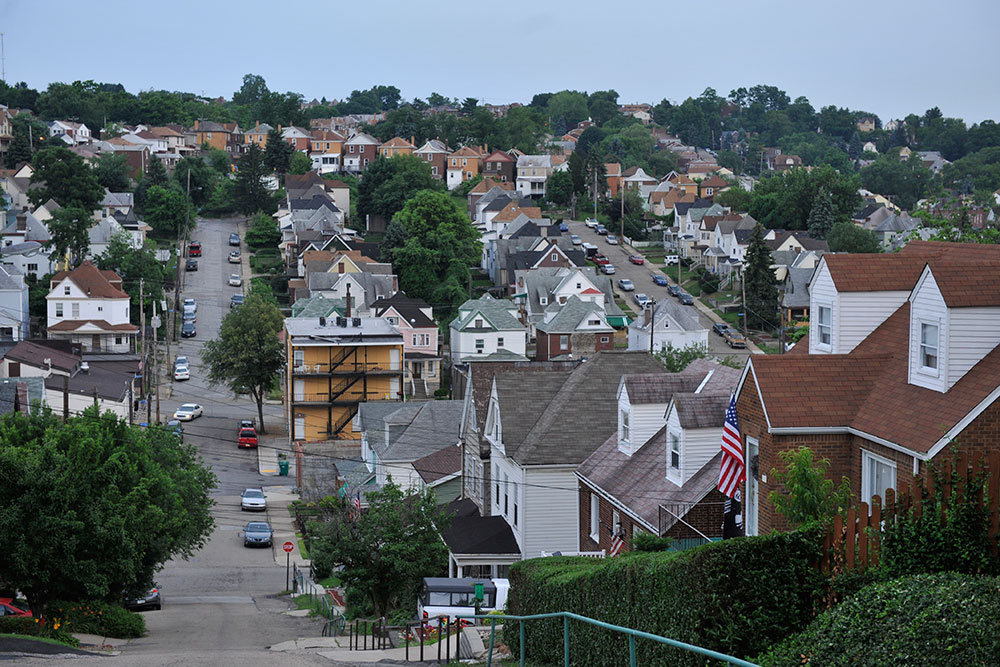 Pittsburgh Hazelwood neighborhood view showcasing residential homes and tree-lined streets, relevant to seasonal roof maintenance guidance.