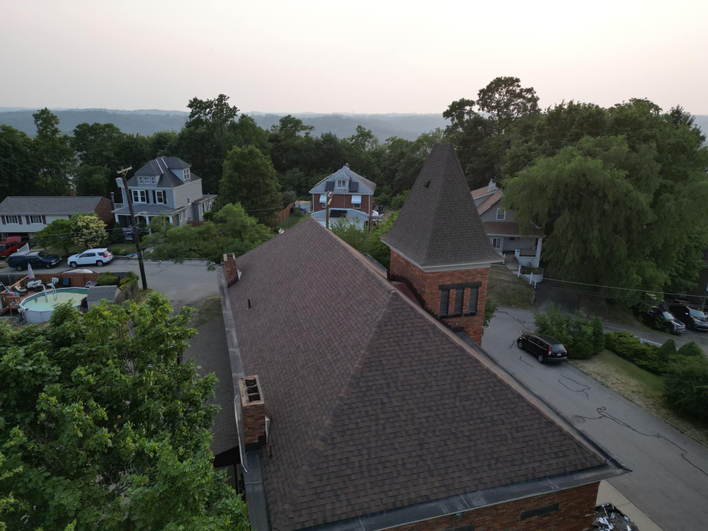 Historic schoolhouse turned residence - transformed by Malick Brothers Exteriors"