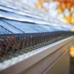 Close-up of a drip edge on a roof, showcasing its protective mesh design, emphasizing its role in preventing water intrusion and safeguarding roofing systems.