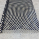Gutter guard made of black mesh material, designed to protect gutters from debris, relevant to roofing maintenance and home exterior solutions.