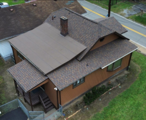 Residential home with a two-layer asphalt shingle roof, showcasing potential roofing code violations related to structural weight limits.