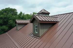 Metal roof with protective coatings, showcasing durability and style, featuring dormer windows against a backdrop of trees, relevant to Pittsburgh homeowners considering modern roofing solutions.