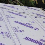 Titanium roof underlayment installed on a sloped roof, showcasing its protective features for roofing systems.