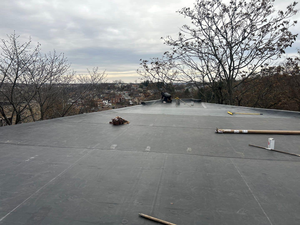 Learn about tailored roofing solutions, membrane roofing systems, and maintenance practices to ensure the longevity of flat roofs