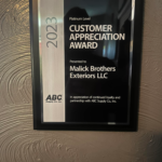 2023 Platinum Level Customer Appreciation Award plaque for Malick Brothers Exteriors LLC, showcasing recognition from ABC Supply Co. Inc. for outstanding service and partnership.