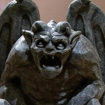 Gargoyle statue with wings and a fierce expression, symbolizing protection and vigilance, relevant to roofing and exterior maintenance themes.