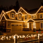 House decorated with Christmas lights, showcasing roof and exterior features, emphasizing seasonal preparation for winter maintenance.