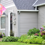 Residential exterior featuring upgraded siding and landscaping, showcasing enhanced curb appeal and aesthetic quality, relevant to Malick Brothers Exteriors' roofing and siding services.