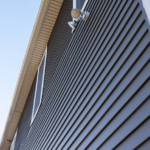 Siding on a Pittsburgh home, showcasing durable, weather-resistant material with horizontal lines and natural light, emphasizing quality and curb appeal.