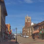 Street view of Fox Chapel showcasing historic architecture and buildings, emphasizing the area's charm and character relevant to high-end roofing solutions.