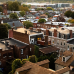 Aerial view of Point Breeze rooftops showcasing diverse architectural styles and materials, highlighting the neighborhood's resilience against varying weather conditions.