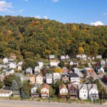 Pittsburgh residential neighborhood showcasing homes with varying architectural styles, emphasizing the importance of soffit and fascia maintenance for homeowners.
