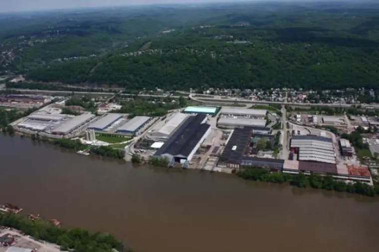 Scenic view of a river flowing through Leetsdale, PA, highlighting the natural landscape of the area."