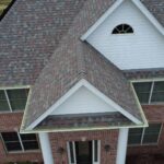 Aerial view of a well-maintained residential roof with shingles, showcasing expert craftsmanship by Malick Brothers Exteriors, a trusted local roofing contractor in Pittsburgh.