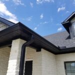 Newly installed black soffit and roofline on a residential home, showcasing quality craftsmanship and modern design in Pittsburgh's exterior renovation.