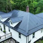 Roofing system on a residential building with a metal roof, showcasing maintenance and longevity, relevant to commercial roofing investment strategies.