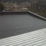 Flat roofing system showcasing modern materials and installation techniques, relevant to roofing solutions for historic homes in Pittsburgh.