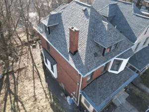 Aerial view of a residential home showcasing Atlas Pinnacle Pristine roofing shingles, highlighting their durability and aesthetic appeal for Pittsburgh homeowners.