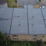 Flat roof of a residential building in Squirrel Hill, showcasing modern roofing materials suitable for historic preservation and maintenance.
