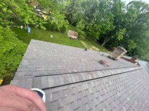 Roof view showcasing shingles and ventilation features, illustrating the importance of proper roof ventilation for energy efficiency in Pittsburgh's humid climate.