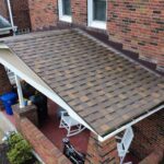 Rubber roofing on a flat porch in Pittsburgh, showcasing durable materials and a well-maintained exterior, emphasizing energy efficiency and low maintenance for local homeowners.