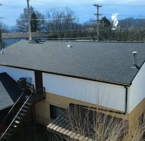 New siding, fascia, gutters and downspouts on a multi unit building by Malick Brothers Exteriors
