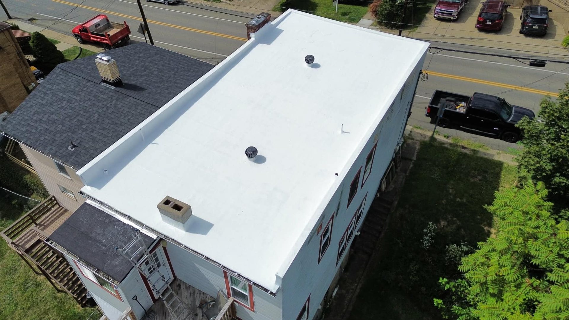 Low slope commercial roof work by Malick Brothers Exteriors in Pittsburgh
