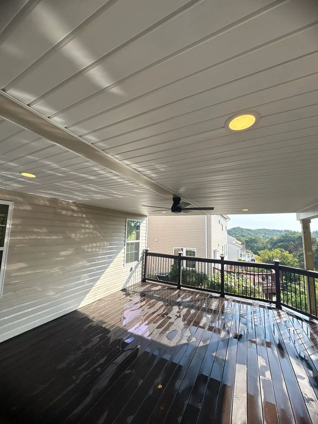 Finished white ceiling with recessed lights and a fan under a new deck roof in Cranberry Township