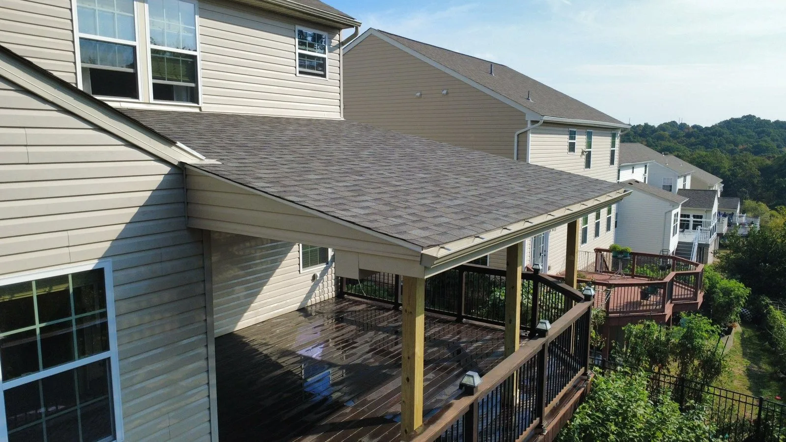 Shingles on a new deck roof tied into the siding of a Cranberry Township home