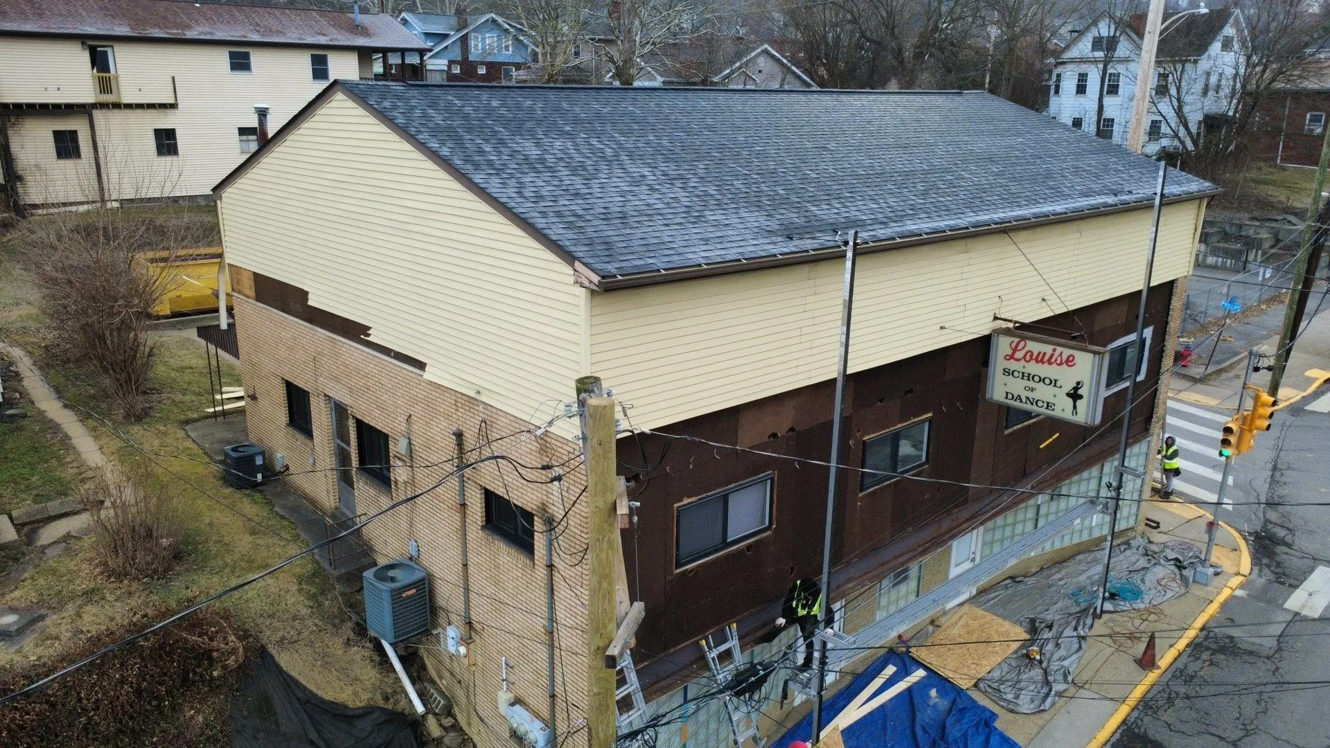 New siding, soffit, fascia and gutters on a multi unit building in Baden by Malick Brothers Exteriors