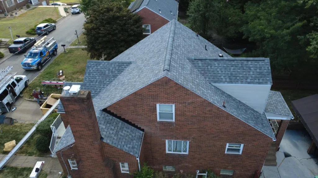 New roof and gutters in Atlas Coastal Granite by Malick Brothers Exteriors in Glenshaw