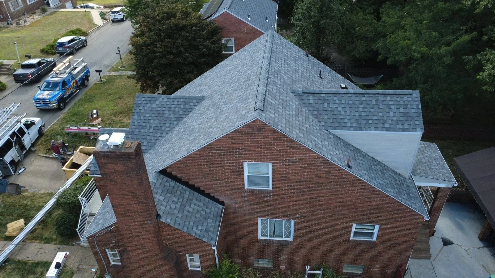 New roof and gutters in Atlas Coastal Granite by Malick Brothers Exteriors in Glenshaw