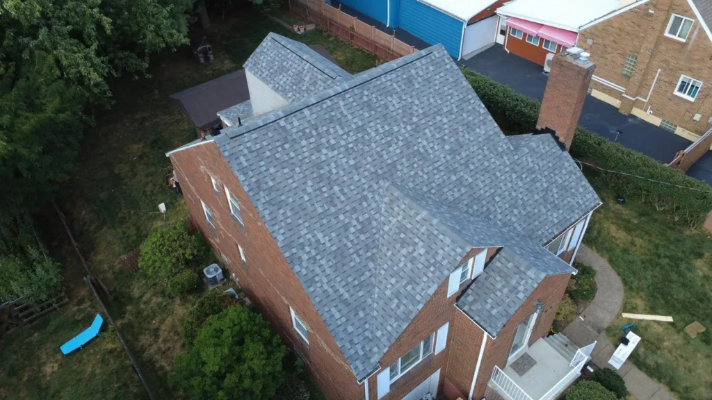 New roof and gutters in Atlas Coastal Granite by Malick Brothers Exteriors in Glenshaw