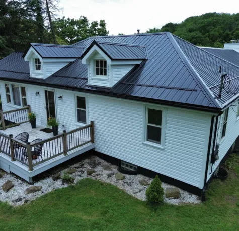 Metal roof panels and dormers on a Wexford home roofed by Malick Brothers Exteriors