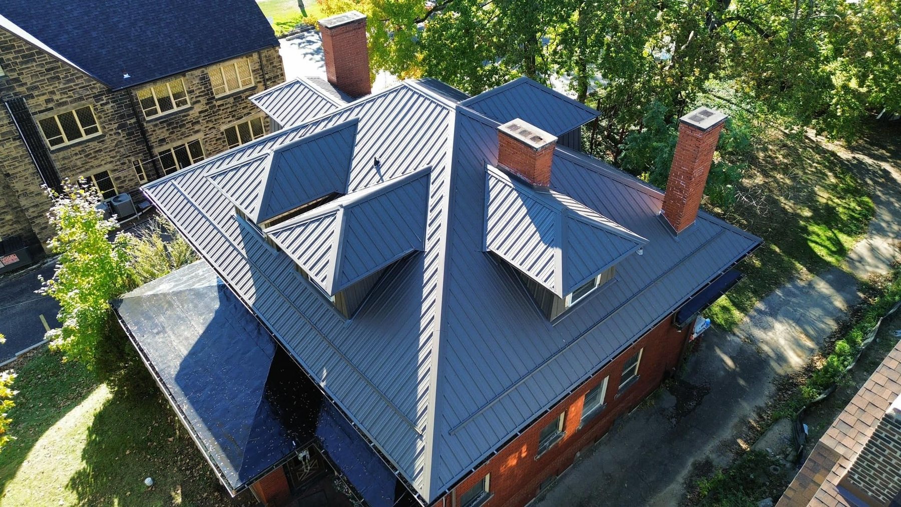 Aerial view of a standing seam metal roof installed by Malick Brothers Exteriors