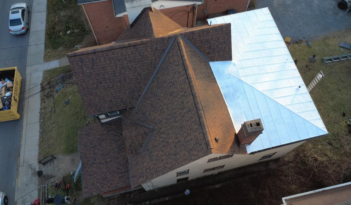 Silver standing seam metal roof section installed by Malick Brothers Exteriors in Bellevue