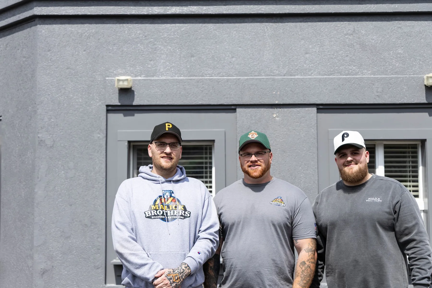 Malick Brothers team outside the Perry Highway shop