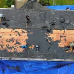 Malick Brothers crew replacing a roof in Allison Park