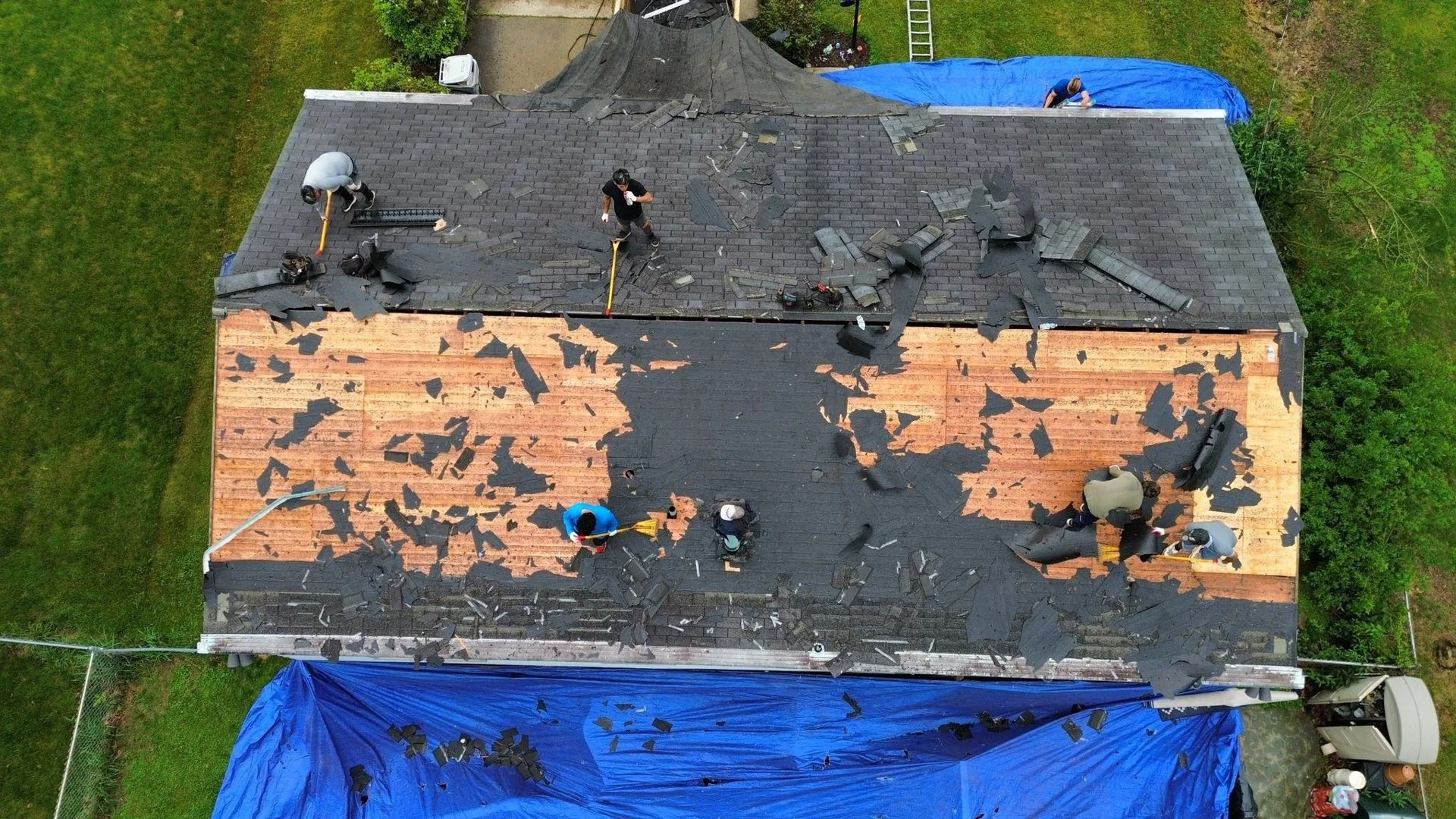 Malick Brothers crew replacing a roof in Allison Park
