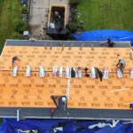 Malick Brothers crew replacing a roof in Allison Park