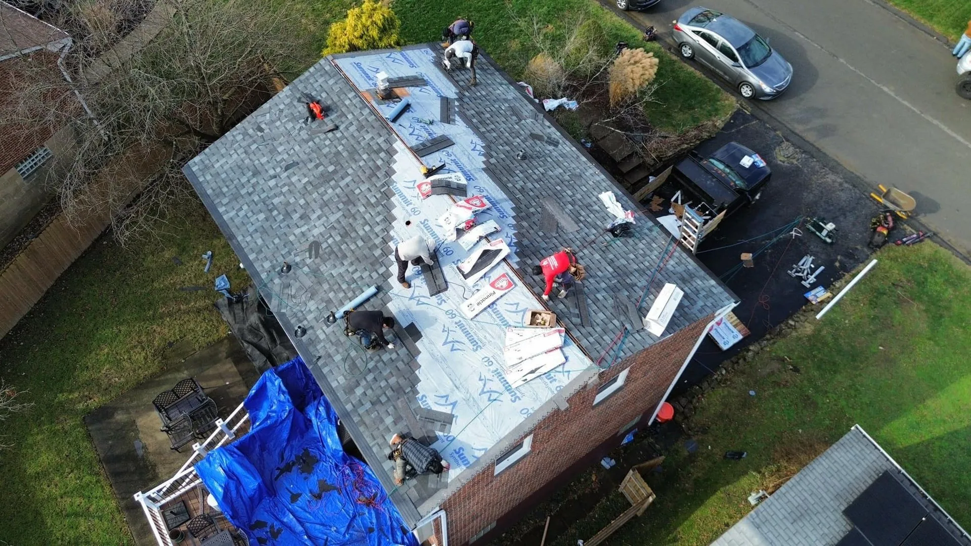 Malick Brothers crew working on a roof in the Pittsburgh area