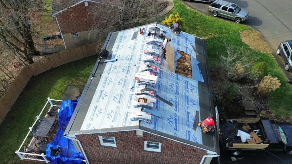 Malick Brothers crew working on a roof in the Pittsburgh area