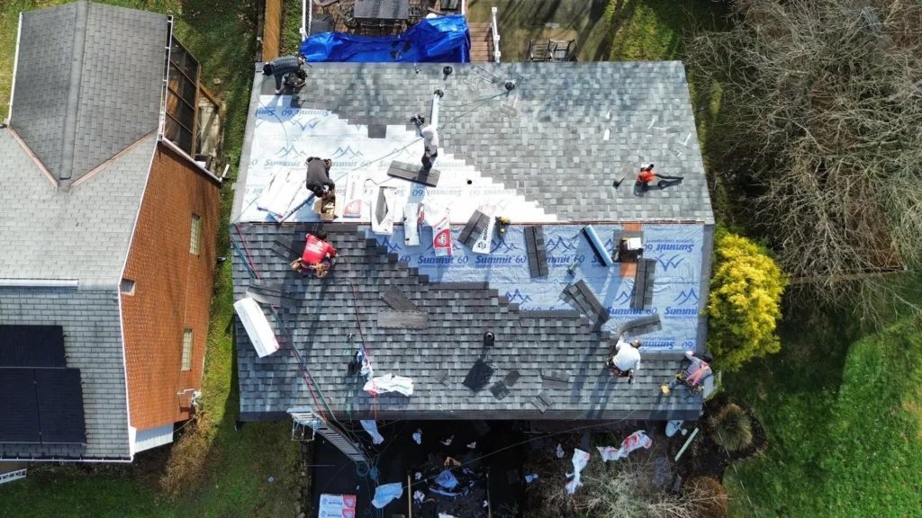 Malick Brothers crew working on a roof in the Pittsburgh area