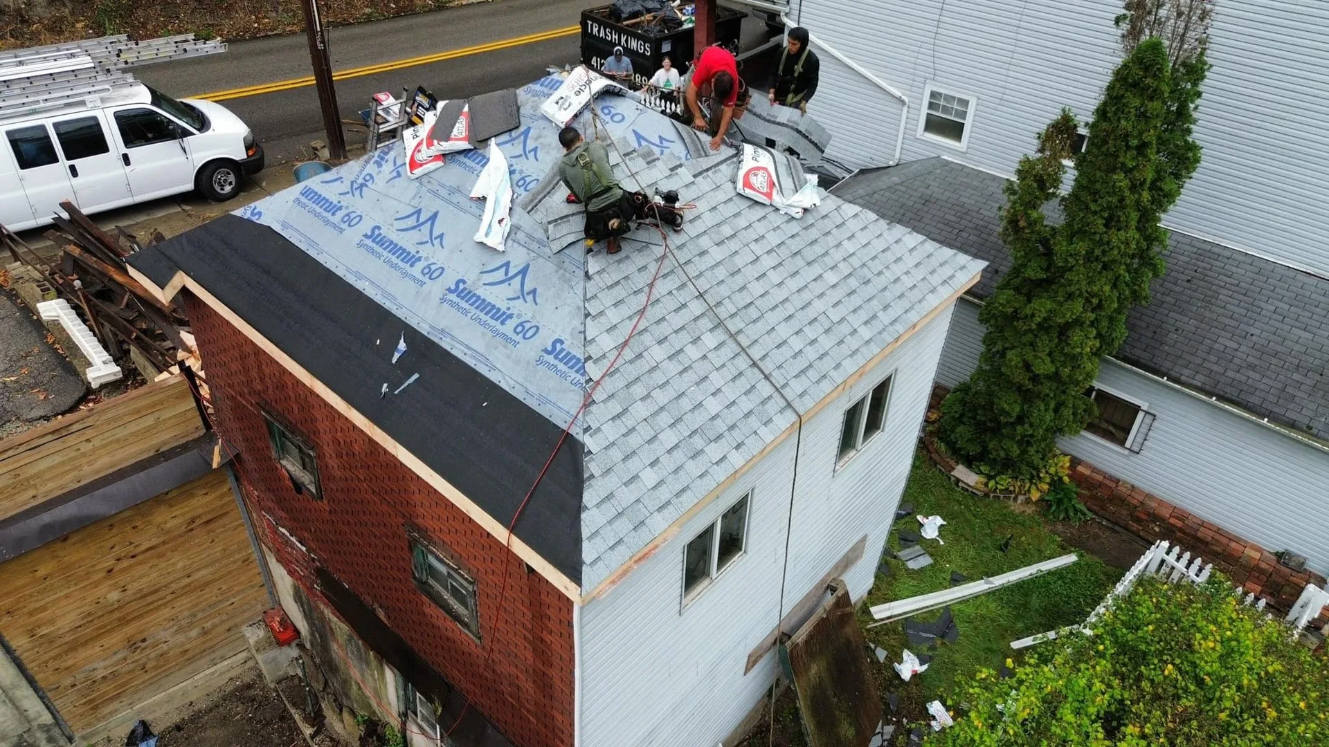 Malick Brothers crew working on a roof in the Pittsburgh area