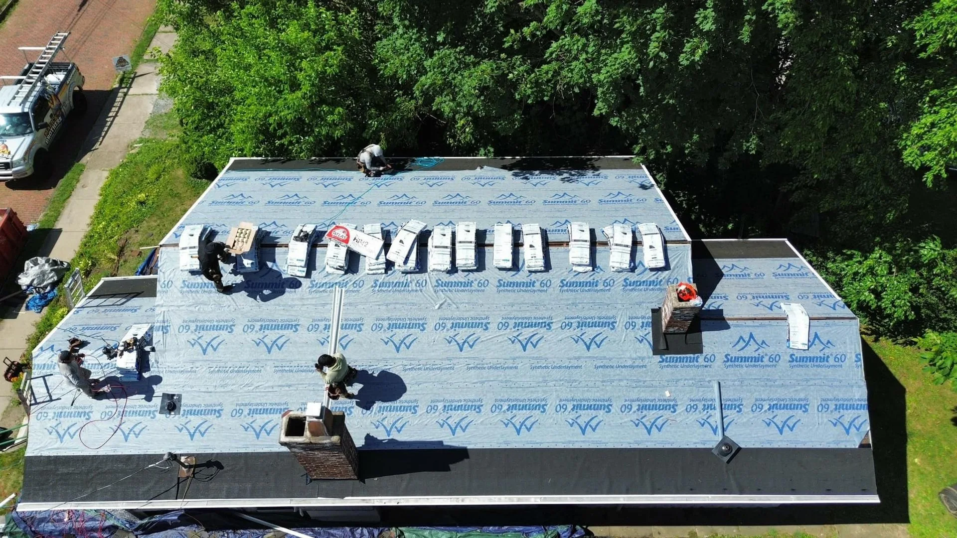 Malick Brothers crew working on a roof in the Pittsburgh area