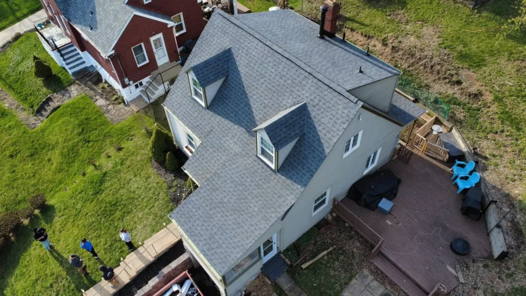 Pewter roof with almond gutters by Malick Brothers Exteriors in Ross Township